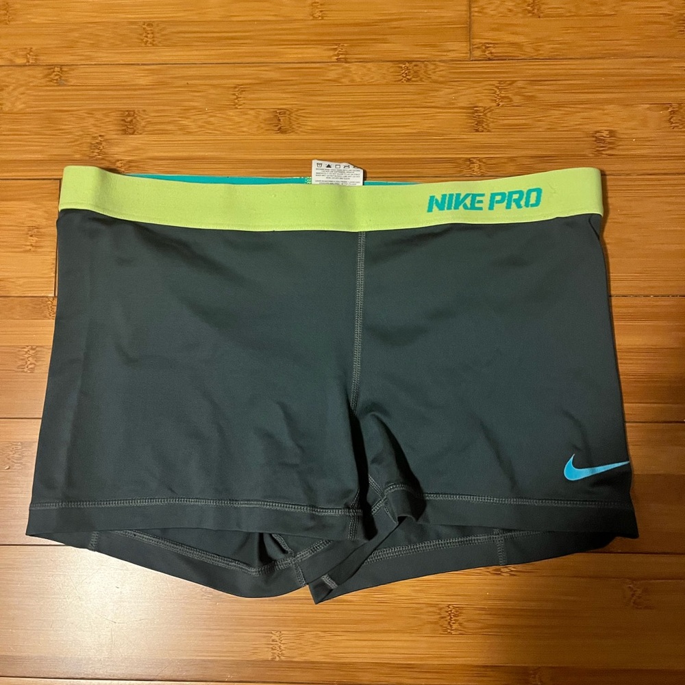 Nike Pros black, green and teal shorts